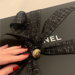 Authentic beautiful Chanel
Box with seasonal fabric ribbon and pin/ button